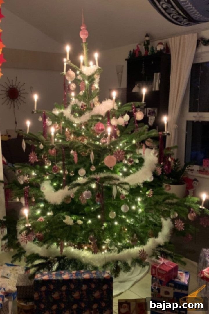 An easy step-by-step guide on HOW TO DECORATE A REAL CHRISTMAS TREE from top to bottom! Traditional natural candles on a real Christmas tree.