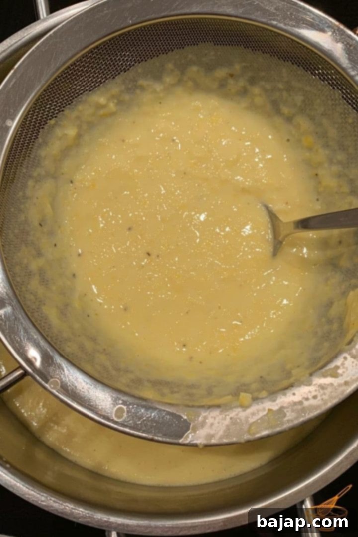 Gluten-Free Sweet Corn Soup 5 Finally, to make the sweet corn soup subtle and smooth, pass it through a fine-mesh sieve into a large bowl.