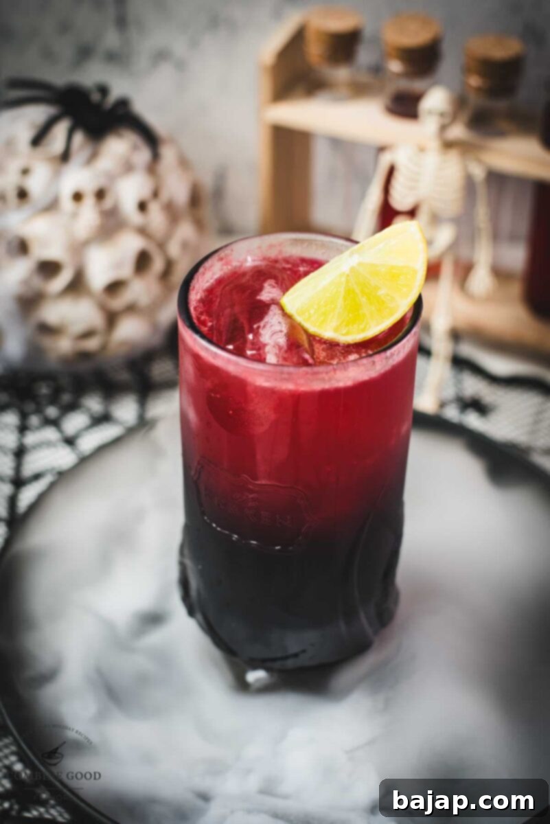 Spooky crimson kraken cocktail with ginger beer and homemade blood syrup.