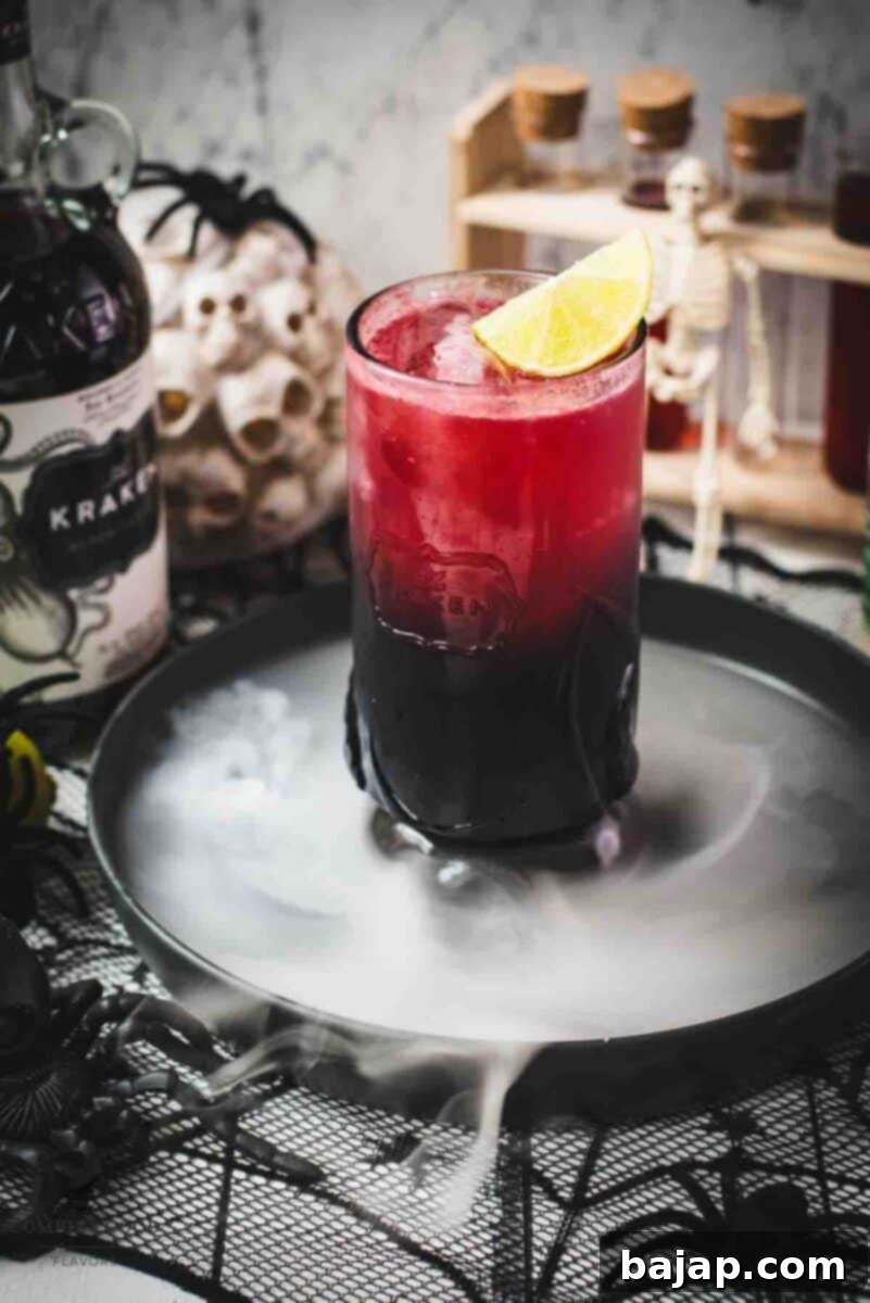 Spooky crimson kraken cocktail with ginger beer and homemade blood syrup.
