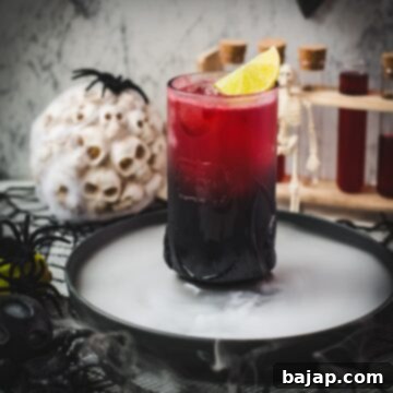 Spooky crimson kraken cocktail with ginger beer and homemade blood syrup.