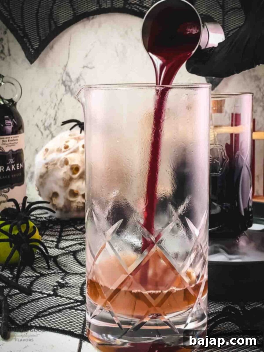 Add homemade berry blood syrup to the stirring glass.