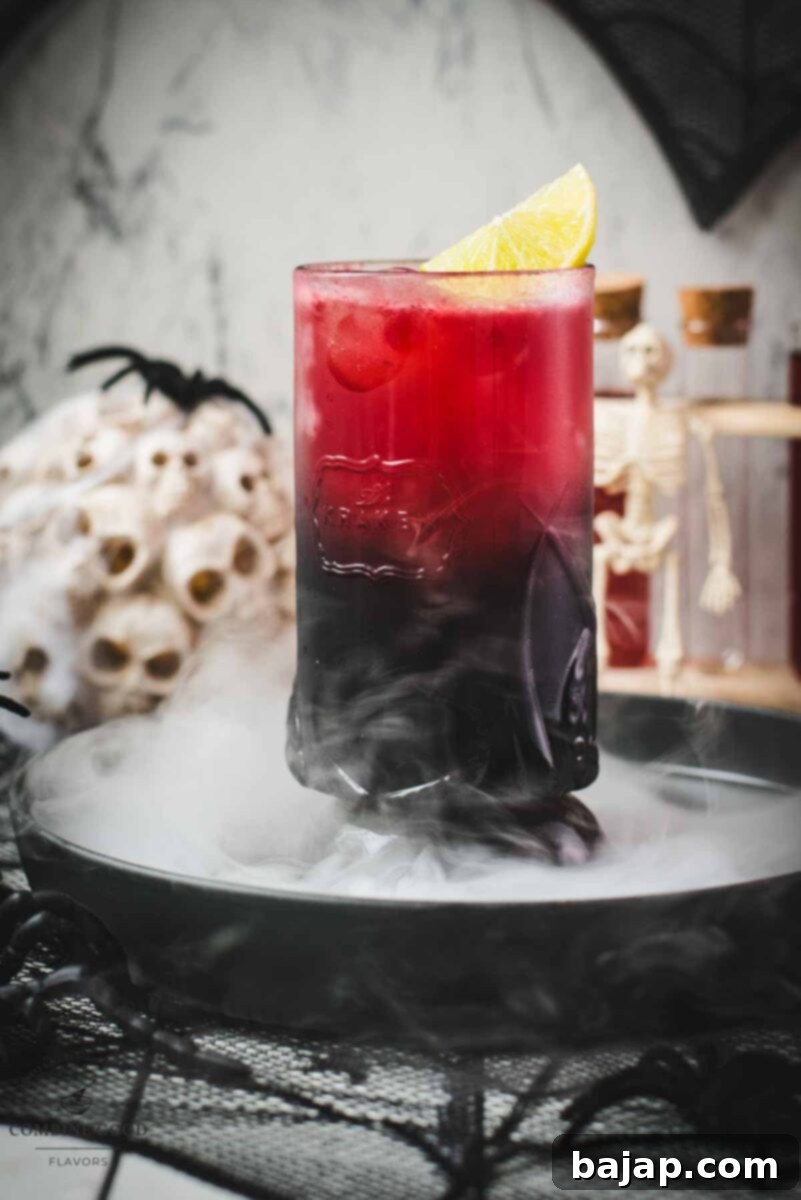 Spooky crimson kraken cocktail with ginger beer and homemade blood syrup.