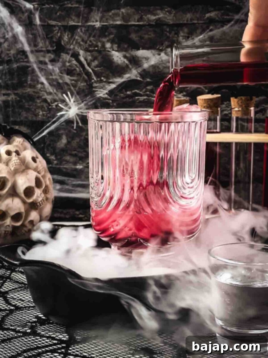 Step 3: Cranberry juice is added, creating another layer.