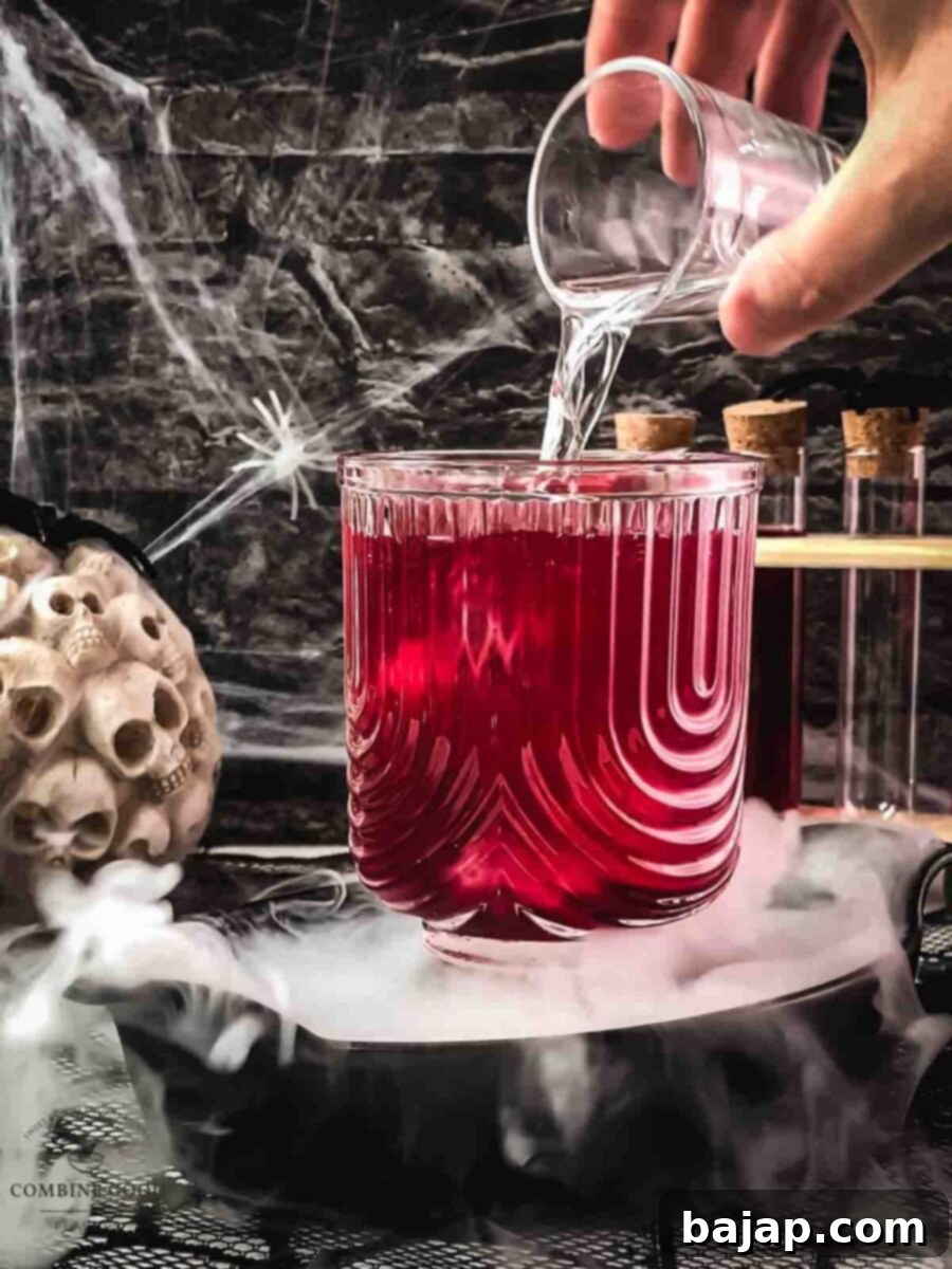 Step 4: Grapefruit juice completes the liquid layers.