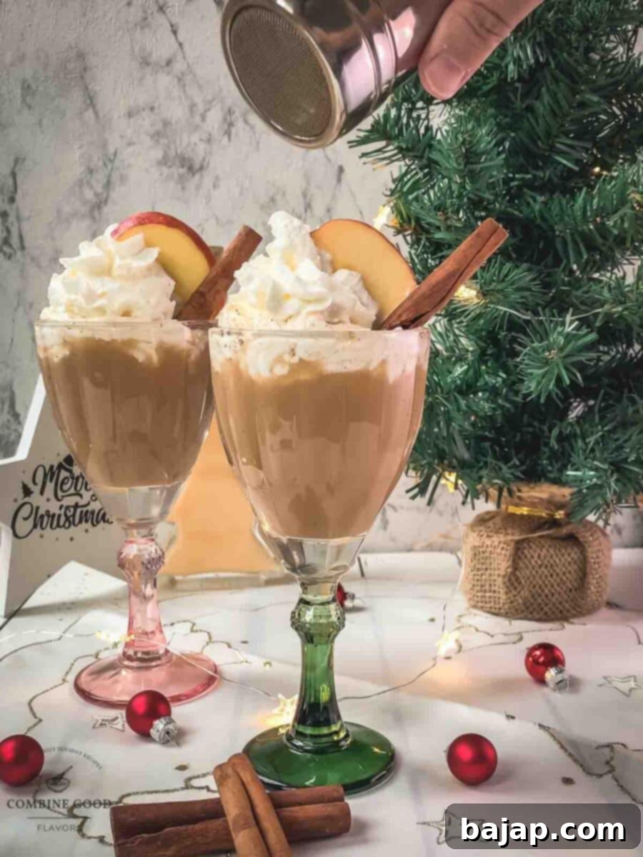 Dust the spiced apple cider with ground cinnamon.