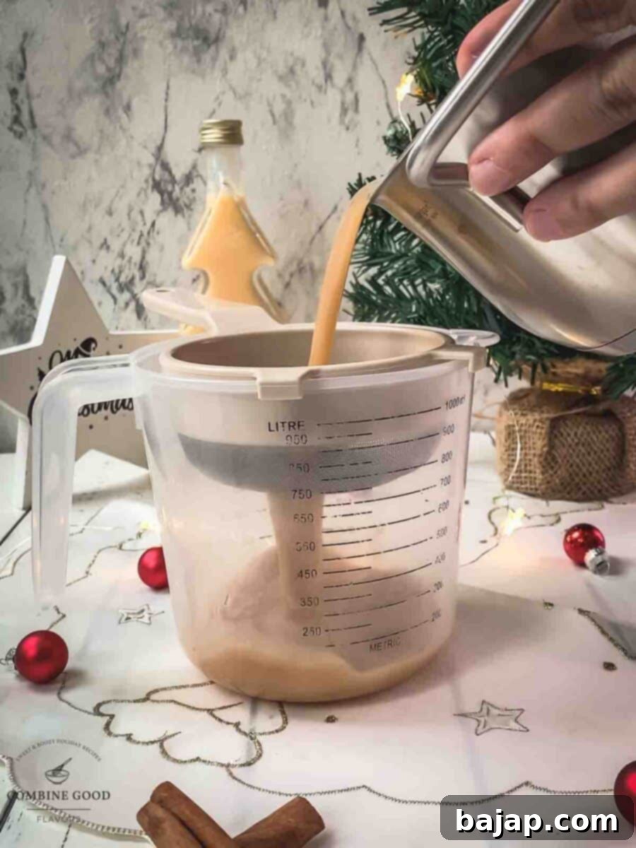 Fine strain the spiced apple cider into a jug.