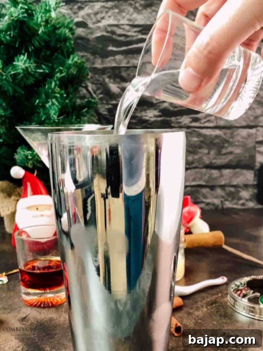 Holiday Nog Dream 4 Adding vanilla vodka to the cocktail shaker for the festive eggnog martini.