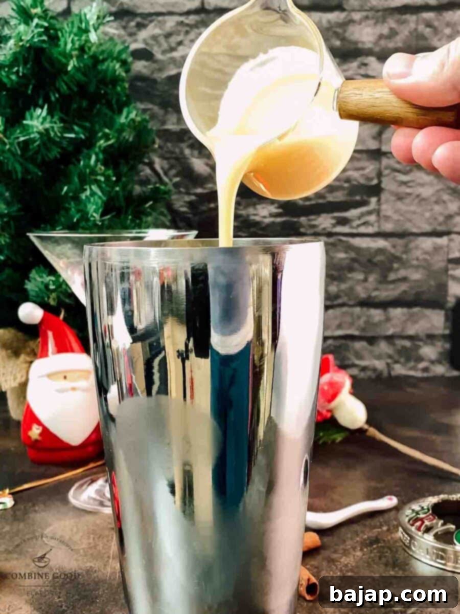 Holiday Nog Dream 6 Adding rich egg liqueur (Eierlikör) to the cocktail shaker for a creamy, golden eggnog martini.