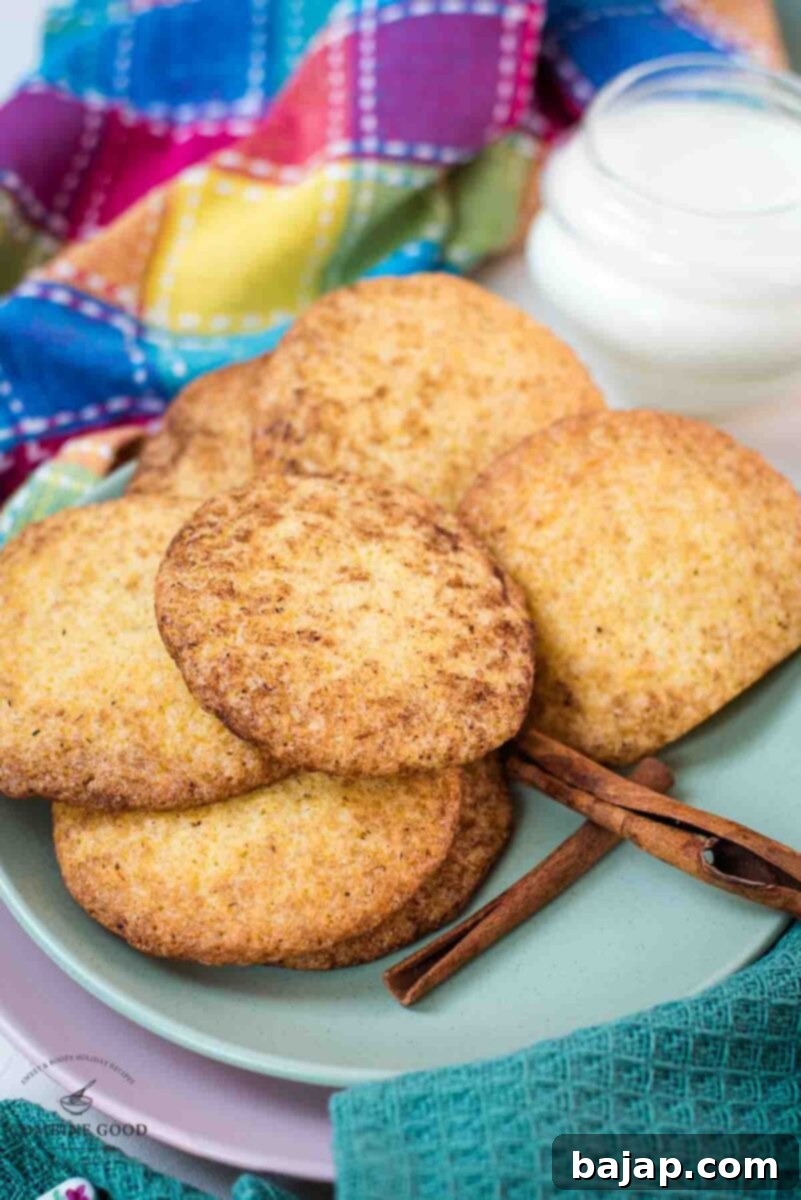 Fluffy snickerdoodle cookies placed on multicolored plates.
