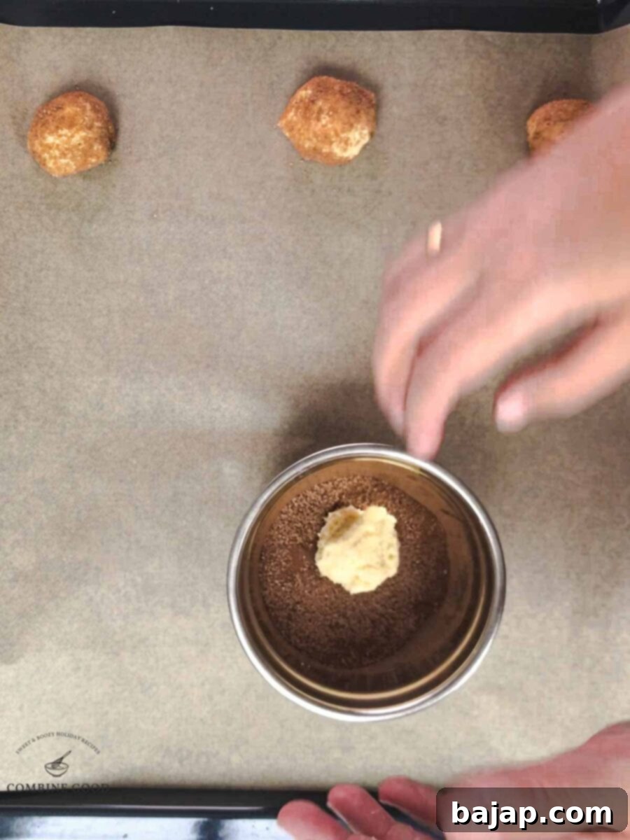 Place the dough ball into the sugar cinnamon mixture.