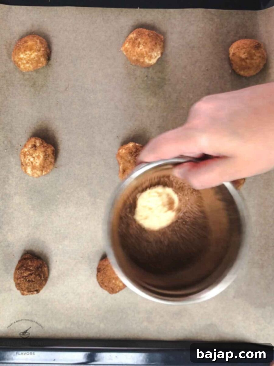 Swirl the dough ball in the sugar and cinnamon mixture to coat it evenly.