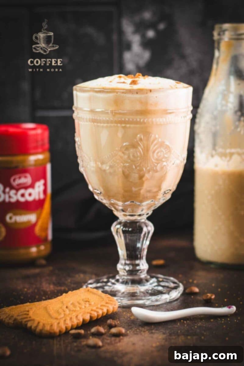 Biscoff Bliss Latte: A Homemade Creamer Delight 3 Close-up of a delicious Biscoff latte with homemade Biscoff coffee creamer, highlighting the creamy texture and the sprinkle of crushed Biscoff cookies on top.