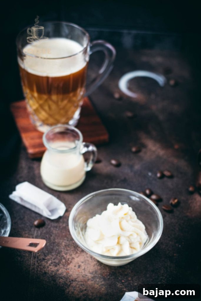 Whipped coffee creamer in small glass bowl.