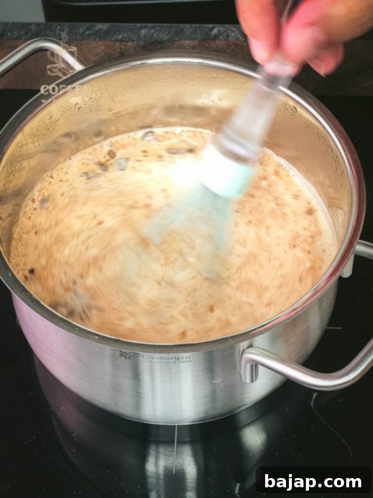 Festive Holiday Coffee Creamer 5 Whisking the Christmas coffee creamer ingredients until well combined.