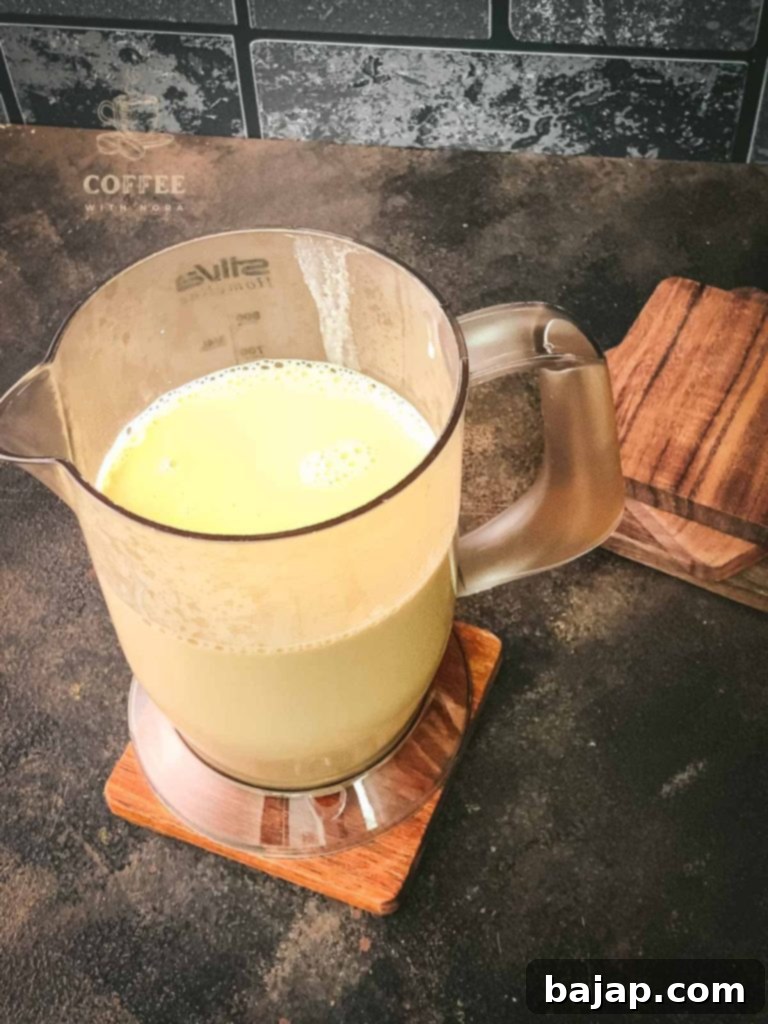 Festive Holiday Coffee Creamer 7 Letting the Christmas coffee creamer cool down before storing.