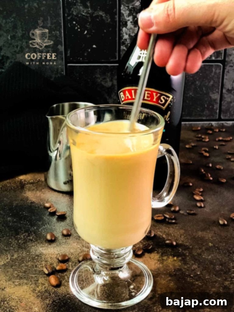 Elegantly Infused: A Baileys Coffee Creation 4 Stirring the coffee and Baileys together.