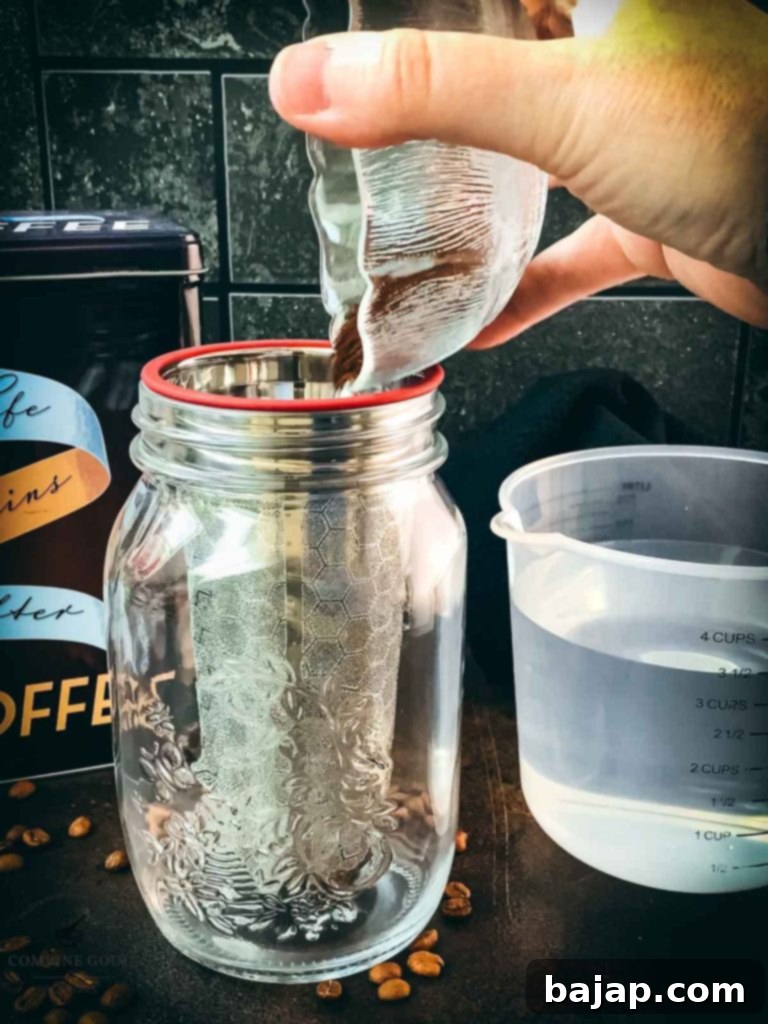 Mason Jar Cold Brew Delight 3 Ground coffee being added to a mason jar.