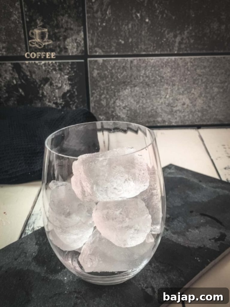 Iced Vanilla Cream Coffee: A Refreshing Homemade Brew 7 Glass filled with cubed ice.