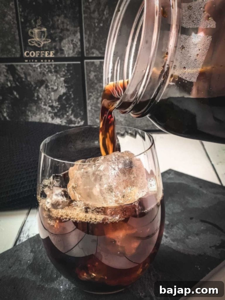 Iced Vanilla Cream Coffee: A Refreshing Homemade Brew 8 Pour the homemade cold brew into the ice cube filled glass.