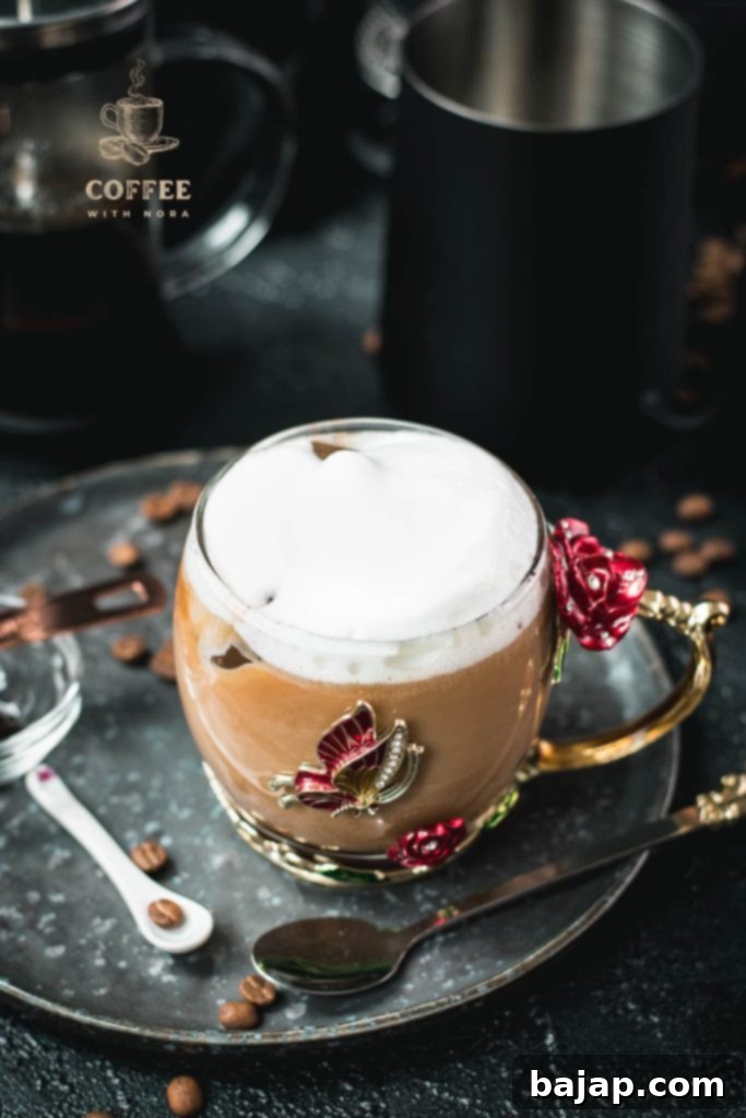 Vanilla Bean Bliss: French Press Iced Coffee 10 Close-up of delicious French press vanilla iced coffee in a butterfly glass.