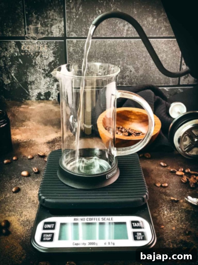 Vanilla Bean Bliss: French Press Iced Coffee 2 Preheating the French press with hot water.