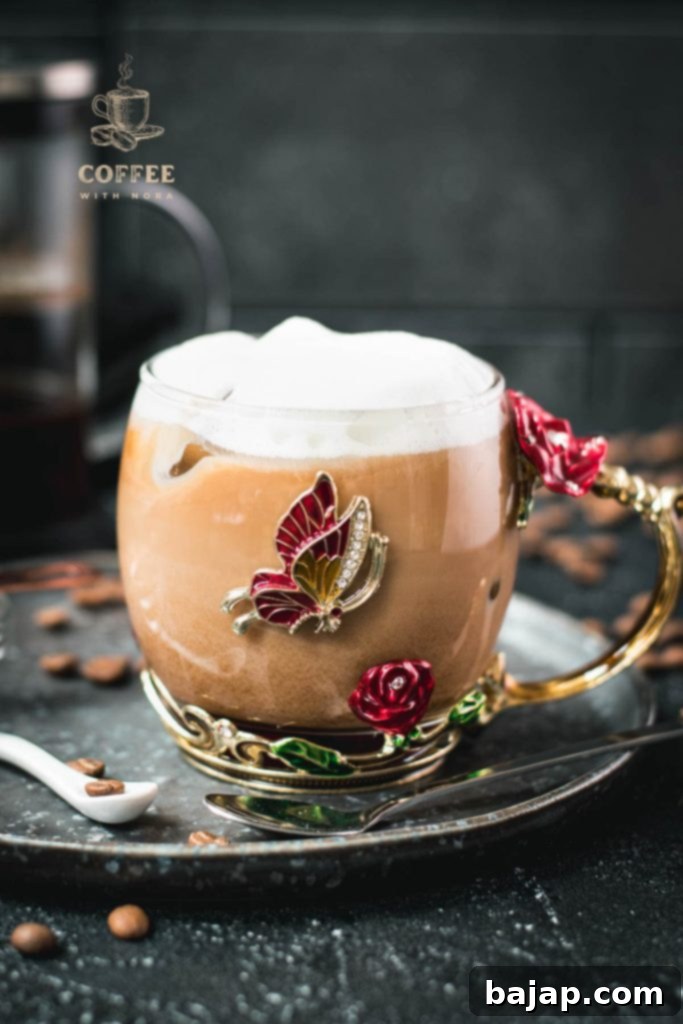 Vanilla Bean Bliss: French Press Iced Coffee 4 Finished French press vanilla iced coffee in a butterfly glass.