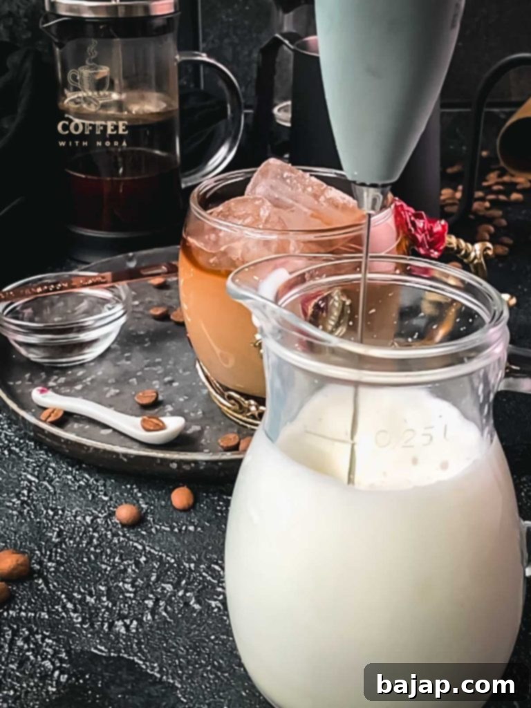 Vanilla Bean Bliss: French Press Iced Coffee 8 Frothing the remaining cold milk.