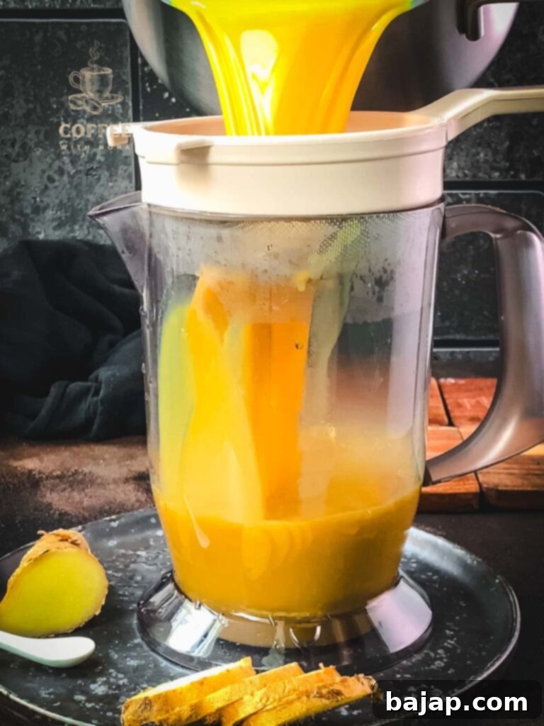 Strain the spiced milk through a close meshed sieve into a tall container.