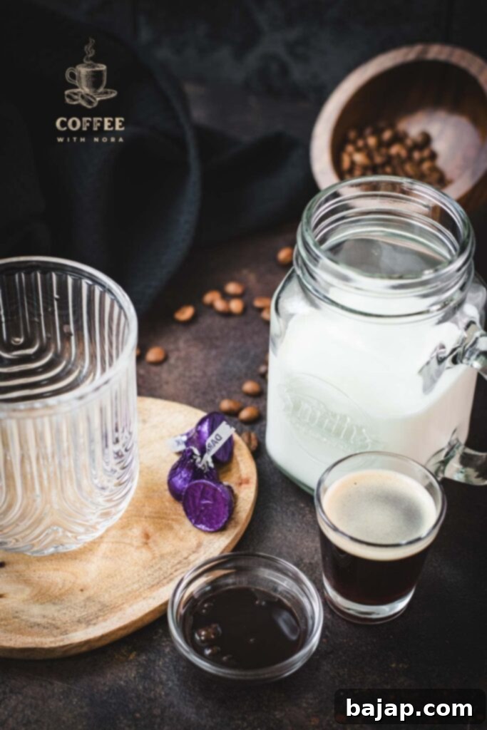 Ingredients for making a mocha: espresso, milk, chocolate syrup, and chocolate sprinkles.