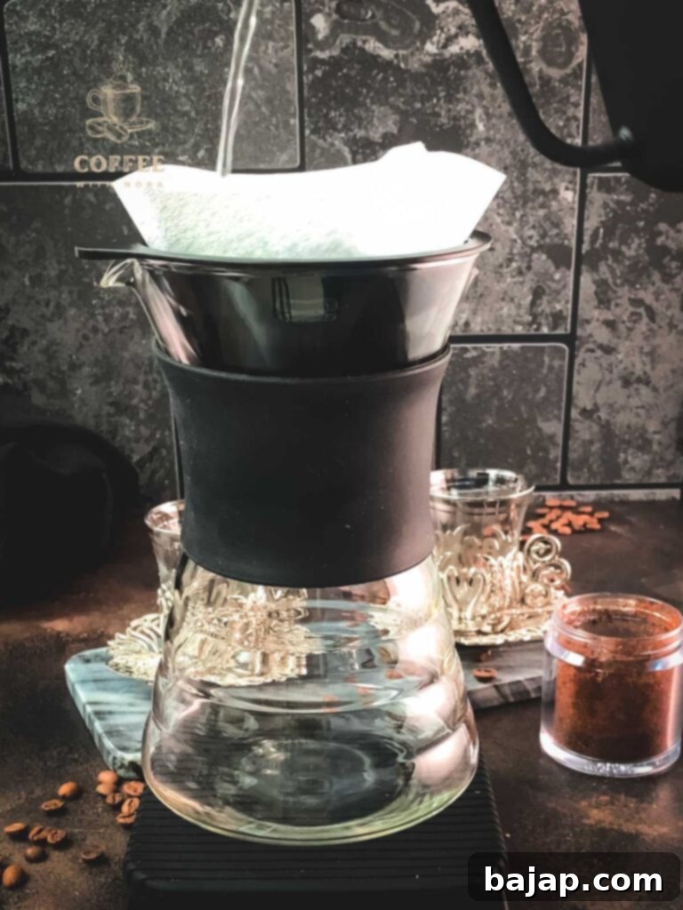 V60 Pour-Over: The Art of the Perfect Cup 4 Rinsing and preheating the Hario V60 coffee dripper.