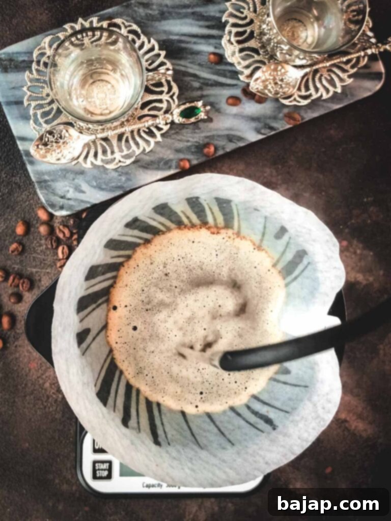 V60 Pour-Over: The Art of the Perfect Cup 6 Pouring hot water into the V60 until the scale reaches 225 grams.