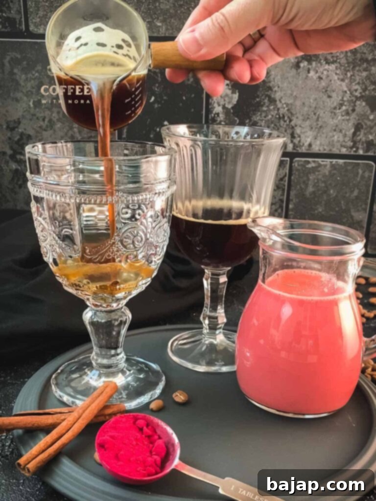 Pouring coffee into serving glasses for the pink latte.