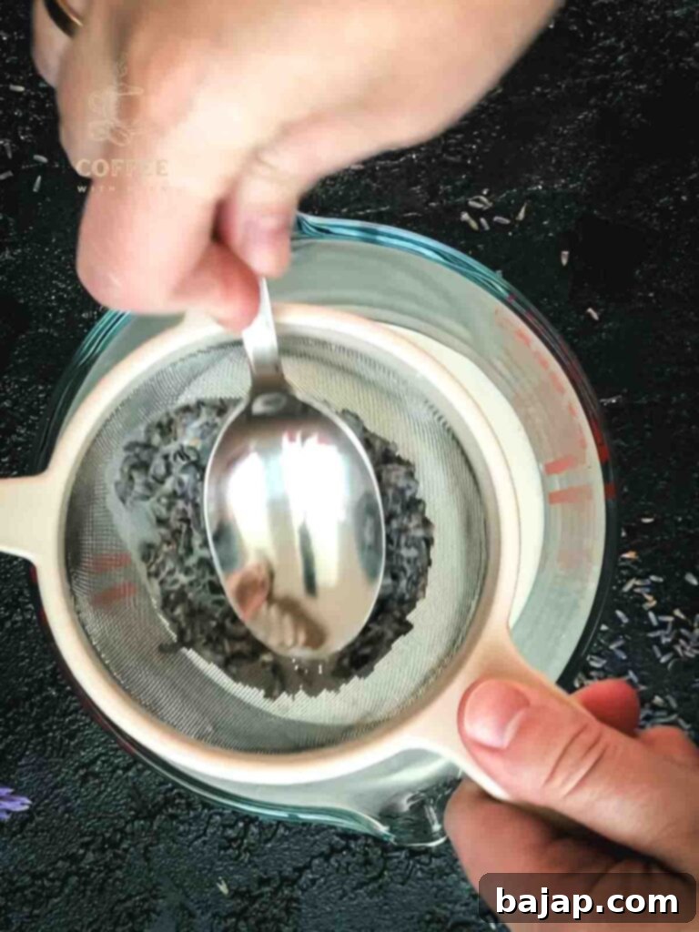 Straining out the lavender buds