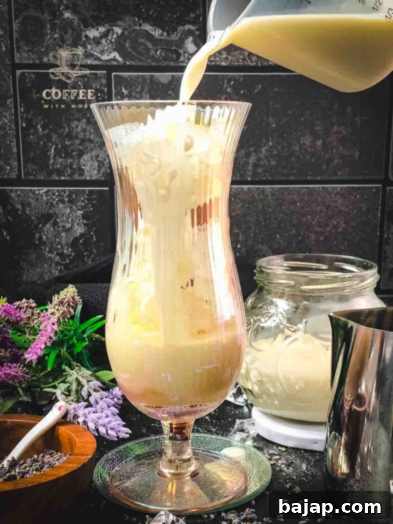 Lavender Dream Iced Latte 4 Add milk to iced lavender latte