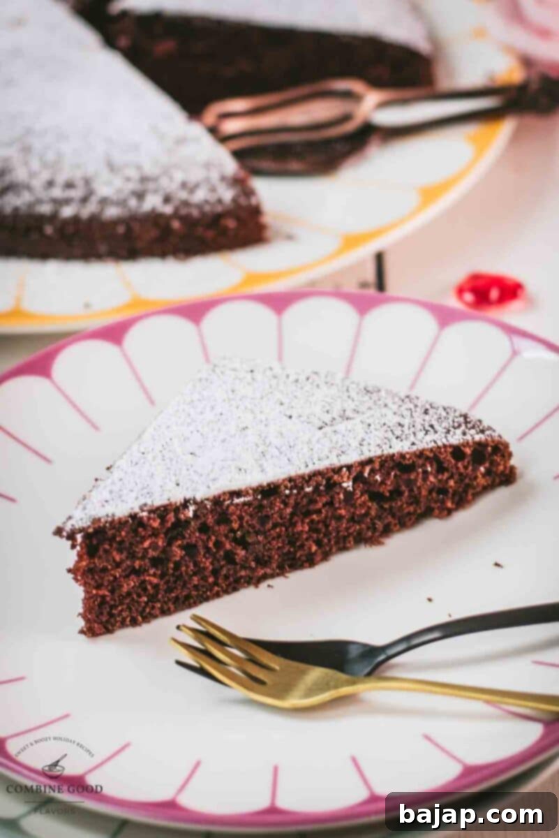 Effortless Valentine's Chocolate Cake 4 Delicious Valentine's chocolate cake slice, dusted with powdered sugar. Ideal for Valentine's day!
